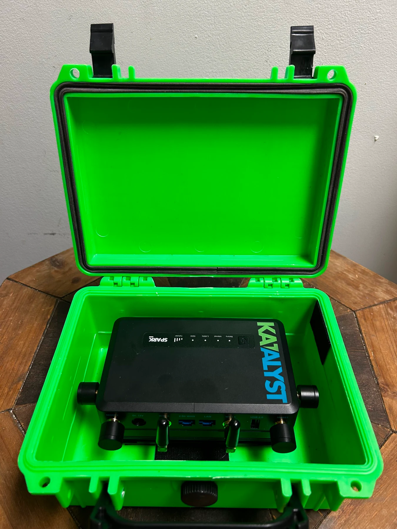 Actual green 5GIRL Micro case open to show Katalyst Spark and compact antennas