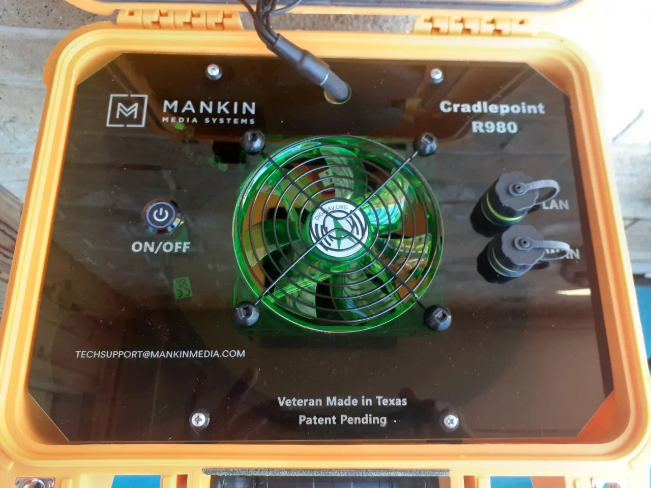 Open orange custom case with Cradlepoint R980 panel