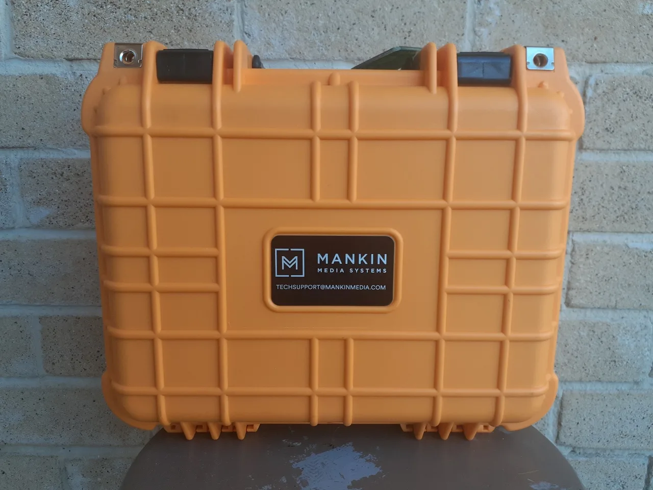 Closed orange custom-branded rugged case
